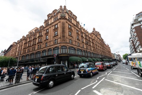 Taxis lined up on the street outside the luxury department stores