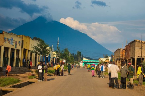 Little village before the towering volcanos of the Virunga National Park