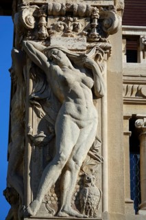 Reliefs of naked woman on the Palazzi degli Ambasciatori Embassy palaces with archway to the Quartiere Coppede