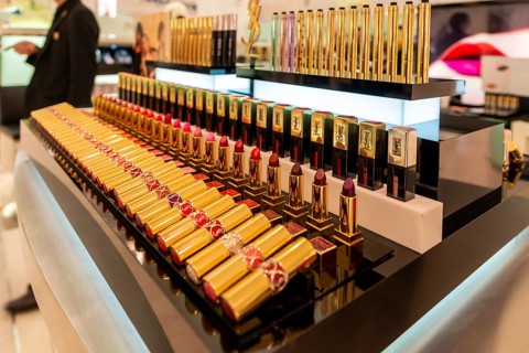 Lined up lipsticks in different shades of red