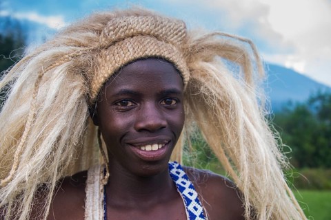 Young man with a wig on a ceremony of former poachers