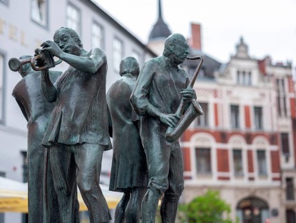 Sculpture Muenzenberger Musikanten on the fountain at the market place in Quedlinburg