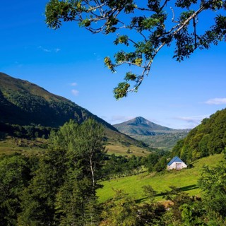 Mountains of Cantal with a barn in foreground