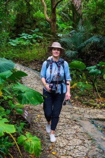 Womna hiking with her baby through the Unesco world heritage site