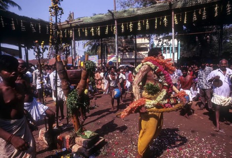 A god possessed man beating himself with whip. Mariamman festival at Coimbatore