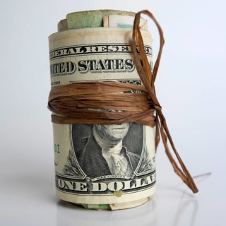 Roll of dollar banknotes