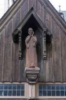 Wooden figure of John the Baptist above the portal of the Protestant St. John's Church in Wernigerode