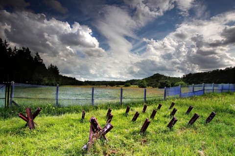 Border fortification with motor vehicle barrier