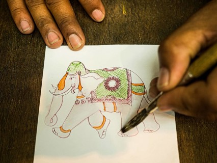 Artist creates traditional miniature painting