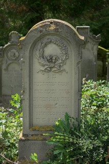 Gravestone with wreath at the historic Jewish cemetery