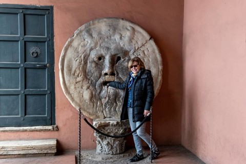 Western tourist puts hand in mouth of truth
