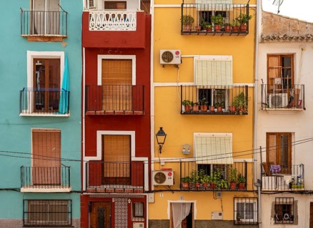Close-up of colorful windows and balconies of fishermen's houses in Villajoyosa