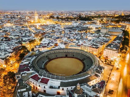Bullring of the Real Maestranza de Caballeria surrounded by white architecture in Sevilla