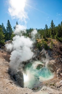 Hot steaming spring with blue water