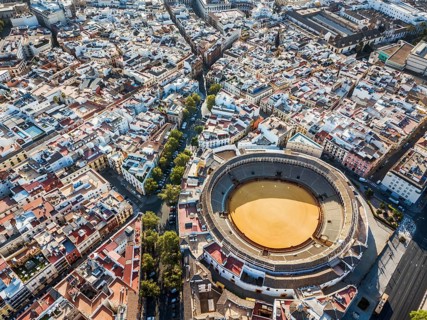 Bullring of the Real Maestranza de Caballeria surrounded by white architecture in Sevilla