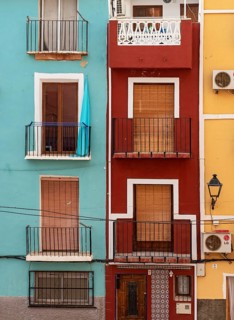 Close-up of colorful windows and balconies of fishermen's houses in Villajoyosa