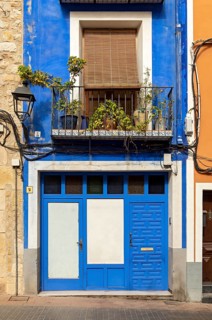 Close-up of colorful windows and doors of fishermen's houses in Villajoyosa