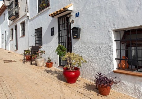 Colorful flowerpots outside white houses of Altea Old Town