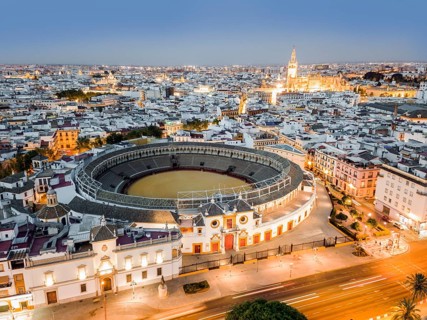 Bullring of the Real Maestranza de Caballeria surrounded by white architecture in Sevilla