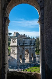 View from round arch of Colosseum to Arch of Constantine