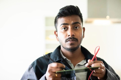Student in an internship at the university with work equipment