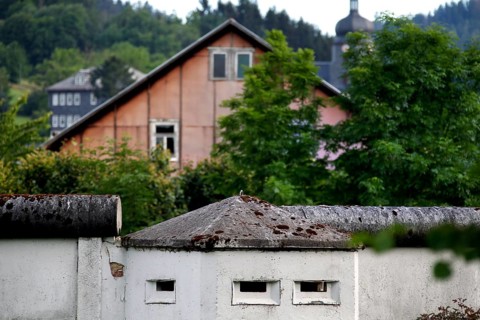 Border wall in front of residential house