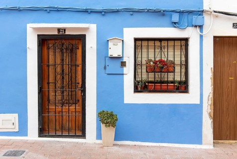 Close-up of door and window of blue fishermen's houses in Villajoyosa