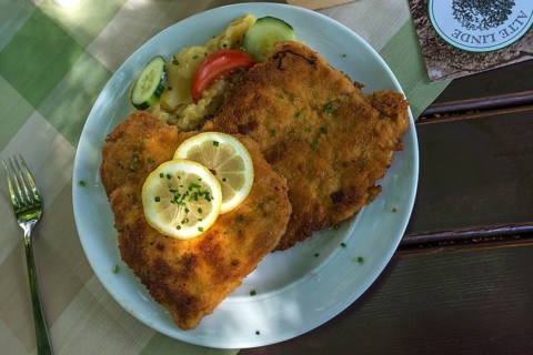 Wiener Schnitzel with potato salad on a plate