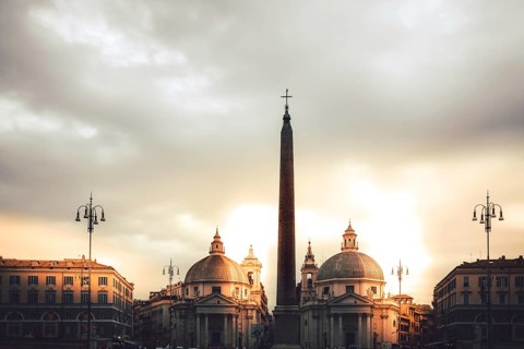 Sunrise in a square with old buildings