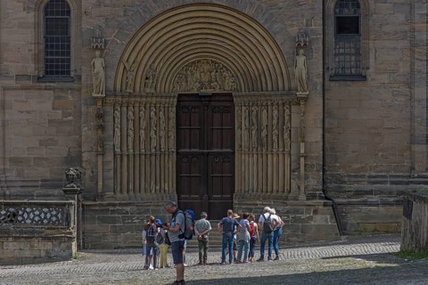 Tourists in front of the prince's portal around 1230