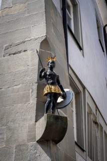 Facade figure of a half-naked black African in the old town of Constance