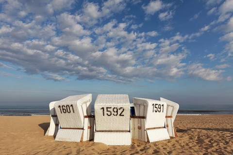 White beach chairs in the morning light