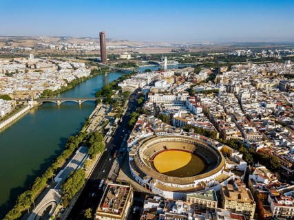 Bullring of the Real Maestranza de Caballeria surrounded by white architecture in Sevilla