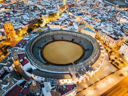 Bullring of the Real Maestranza de Caballeria surrounded by white architecture in Sevilla