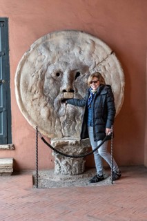 Western tourist puts hand in mouth of truth