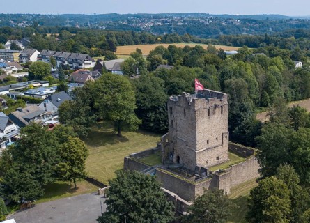Fortified castle tower of ruin of partly reconstructed former moated castle Burg Altendorf from the Middle Ages