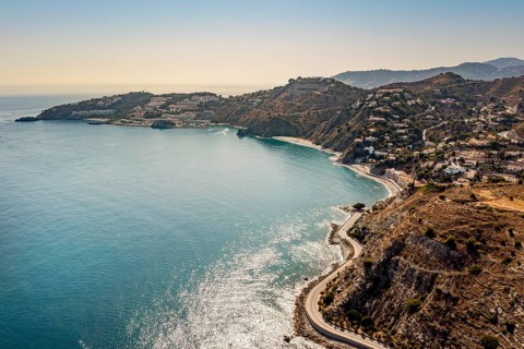 Aerial view of touristic coast in Almunecar by Mediterranean Sea