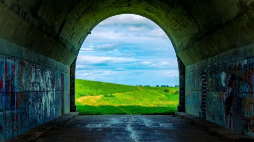 Tunnel and a view of the meadows. The tunnel under the 'Knybawa Bridge' over the Vistula River. Tczew