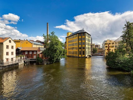 Former factory building Styrkjaern on the island of Laxholmen in the Motala stroem river