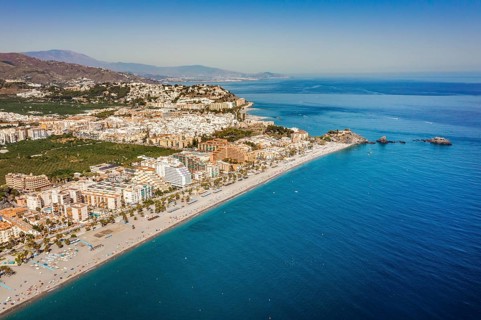 Aerial view of touristic coast in Almunecar by Mediterranean Sea