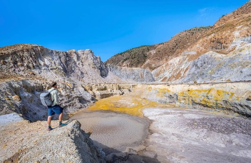 Young man at the crater rim
