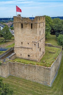 Fortified castle tower of ruin of partly reconstructed former moated castle Burg Altendorf from the Middle Ages
