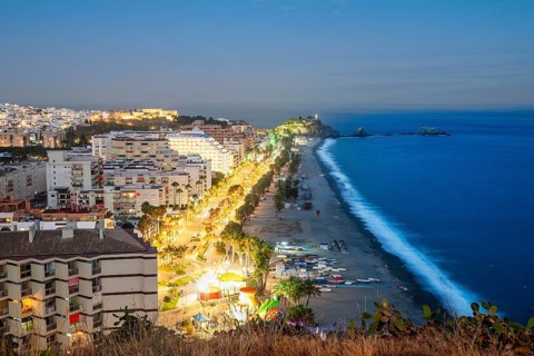 Panorama of touristic illuminated coast in Almunecar at night
