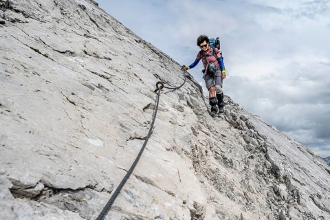 Hiker descending rocky terrain