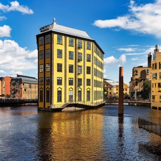 Former factory building Styrkjaern on the island of Laxholmen in the Motala stroem river