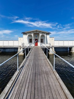 White cold bathhouse by the Baltic Sea