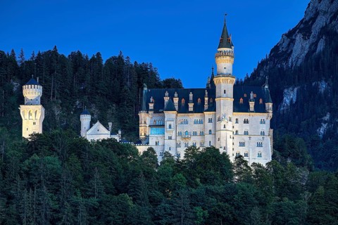 Illuminated Neuschwanstein Castle in the last evening light
