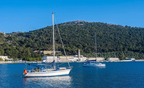 Two sailboats in the bay of Panormitis