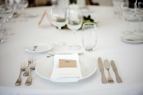 Table setting in a fancy restaurant before wedding reception