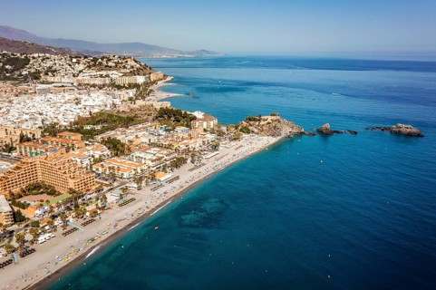 Aerial view of touristic coast in Almunecar by Mediterranean Sea